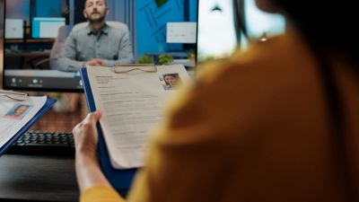 Businesswoman reading freelancer cv discussing hiring offer